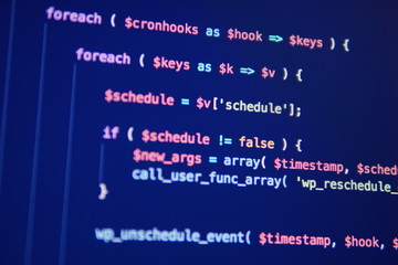 Simple website HTML code with colorful tags in browser view on dark background. Software developer...