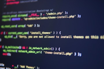 Simple website HTML code with colorful tags in browser view on dark background. Software developer...