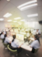 Blurred image of group of students are learning and sitting at desk using computer lap together in classroom for study and workshop in computers room at secondary school. education technology concept.