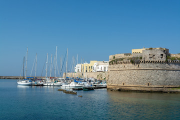 Fototapeta na wymiar Old sea port of Gallipoli, Apulia, Italy, famous vacation destination with beatiful white sand beaches