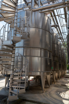 Modern bio wine production factory in Italy, inox steel tanks used for fermentation of wine grapes