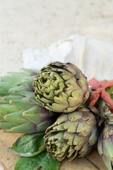 Obraz premium Traditional Italian food, fresh green artichoke vegetables, new harvest, uncooked