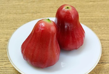 Two Red Water Apples on White Plate