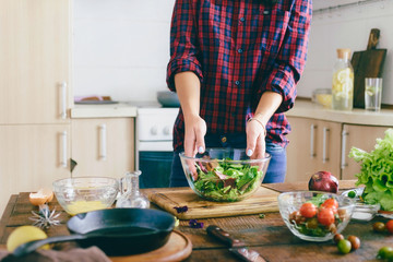 Young woman cooking healthy simple food home kitchen sunny morning Healthy food concept