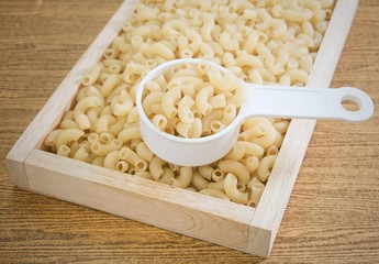 Elbow Macaroni or Gomiti Pasta in Measuring Cup