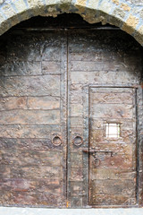 Close-up of metal massive door in an ancient fortress Gonio, Georgia