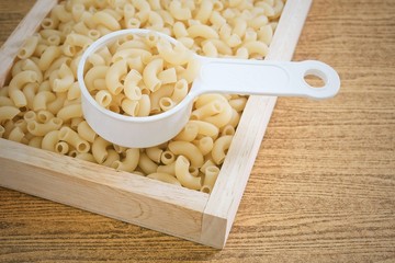 Elbow Macaroni or Gomiti Pasta in Measuring Cup
