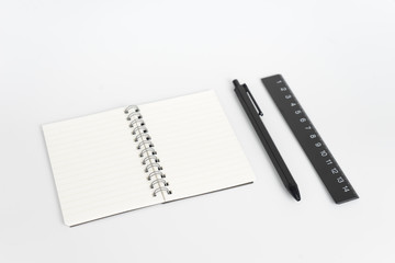 Stationery set such as Note books Ruler and Pens on white background.
