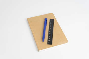 Stationery set such as Note books Ruler and Pens on white background.