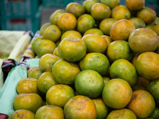 A lot of orange piles in a basket.