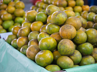 A lot of orange piles in a basket.