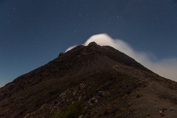 Smoke from Merapi volcano under stars at night. Version 2.