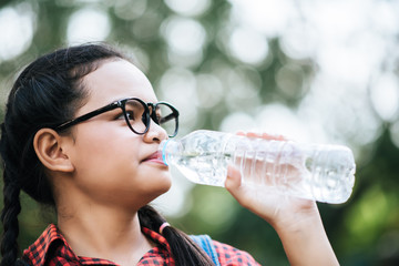 Young girl drinking water