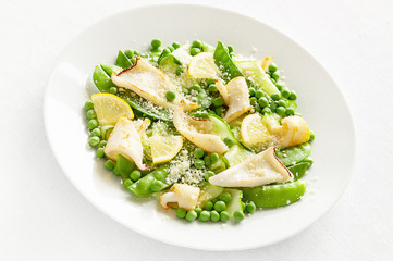 calamari pea salad with cucumber, lemon and grated cheese dressed with oil and vinegar