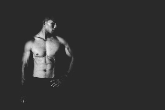 Strong Athletic Man showing muscel in white tone