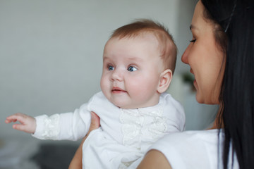 Young cute mom with daughter. The concept of a happy family and motherhood