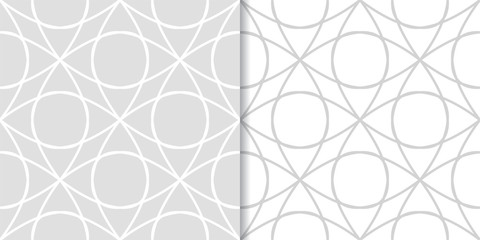 Light gray geometric ornaments. Set of seamless patterns