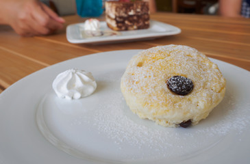 Scones on wooden table.