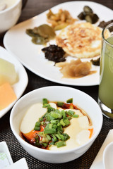 Tofu with  soya sauce on white bowl