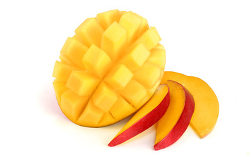 Mango fruit half with slices isolated on white background close-up