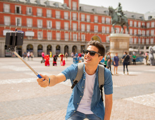 Handsome young caucasian tourist man happy and excited taking a