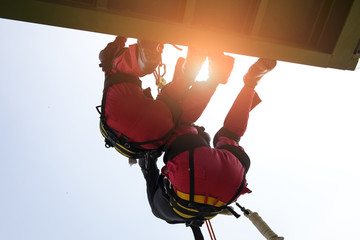 Obraz premium Rescue team in action practicing in climbing equipment . Rescue concept.