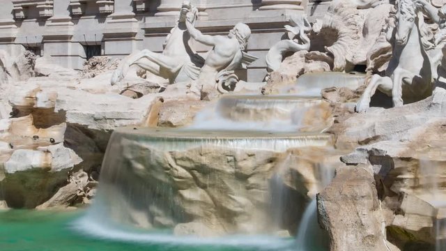 Trevi fountain in Rome, timelapse in day light, pan from the bottom to Neptune statue