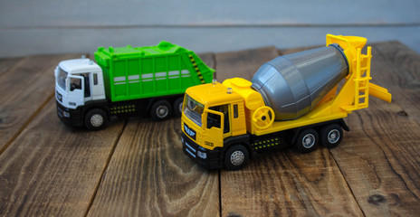 garbage truck and concrete mixer