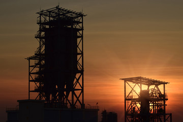 Silhouette construction site .