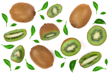 Kiwi fruit with slices decorated with green leaves isolated on white background, close-up. Top view. Flat lay pattern