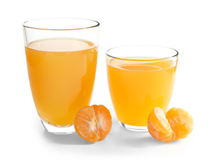Glasses of tangerine juice and ripe peeled fruit on white background