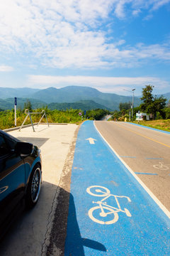 Bike path blue color lane and beautiful view, Big mountain with blue sky.