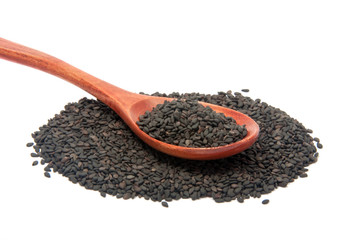 black sesame seeds in wooden spoon isolated on the white