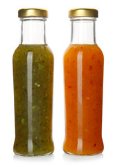 Bottles with tasty sauces on white background