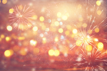 abstract gold and silver glitter background with fireworks. christmas eve, 4th of july holiday concept.