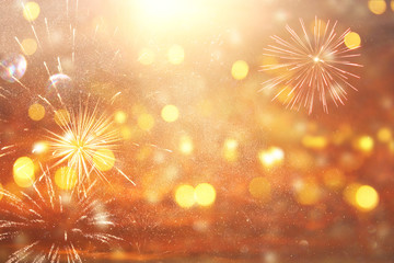 Fototapeta premium abstract gold and silver glitter background with fireworks. christmas eve, 4th of july holiday concept.