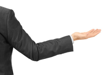 Obraz premium Young businessman holding something on white background
