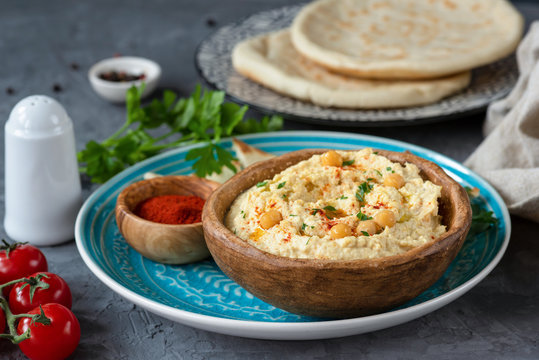 Homemade chickpea hummus and pita bread. Traditional middle eastern food, meze or appetizer.