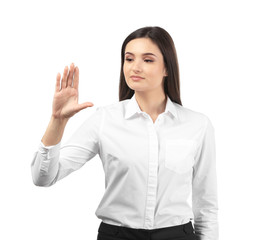 Young businesswoman using virtual screen on white background