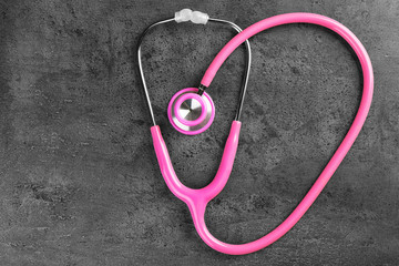 Stethoscope on dark grey background