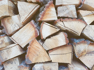 Firewood background, wall firewood, background of dry chopped firewood logs in a pile