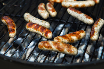 Grilled Sausages on  Barbeque Grill. Charcoal Grill. Selective Focus
