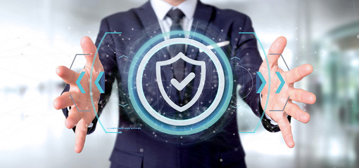 Fototapeta premium Man holding a Shield web security concept 3d rendering