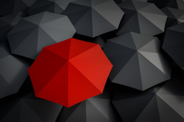 Red umbrella and many black umbrellas around
