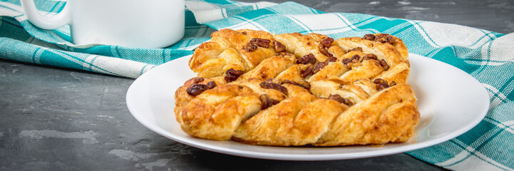 Danish pastry maple pecan with nuts and maple syrup, banner