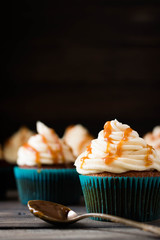Caramel cupcakes on a dark background