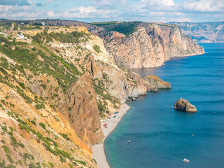 the rocky islands. high rocky cliff and boats at sea. Aerial view