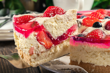 Cheesecake with strawberries, blueberry and jelly