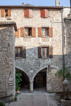 Old stone buildong wth archway in Peille, France