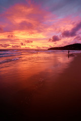 Fototapeta premium Beautiful sunset on ocean beach. Sky is reflecting at water.